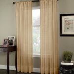 Beige curtains on the rings