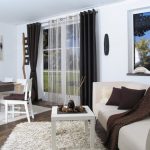 Black curtains and white tulle on the grommet