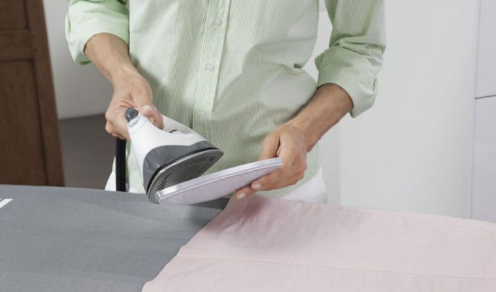 Ironing an organza curtain with a cap
