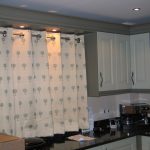 Short curtains on the grommet for the kitchen