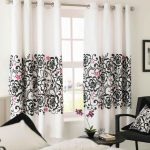 Beautiful curtains in the living room on the eaves with grommets