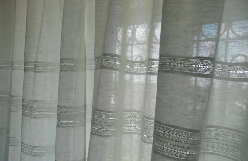 Linen curtain on the window of a private house
