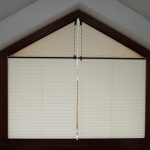 Unusual window in the form of a house, you can close the blinds
