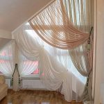 The original and unusual model curtains on a triangular window