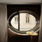 Oval closes with classic curtains