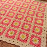 Plaid avec des marguerites de carrés