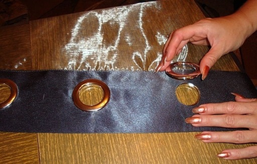 Grommets are installed on both sides and snap into place.