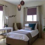 Fluffy curtains in the bedroom on the grommet