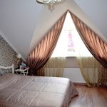 Curtains for the bedroom at the triangular window of the attic