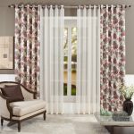 Curtains and tulle for the living room on the grommet