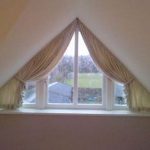 Curtains with triangular window grippers