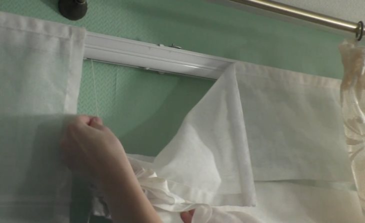 Removing the Roman curtains for washing in a typewriter