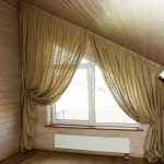 Trapezoidal window with asymmetrical curtains