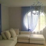 Blue tulle and curtain for living room with round window