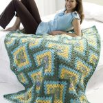 Plaid tricoté de carrés situés sur la diagonale