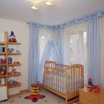 Curtains on the grommet in the room for the boy