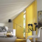 Yellow shutters on trapezoidal window