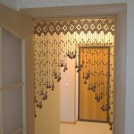 Wicker curtain of ropes in the corridor of a city apartment