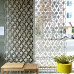 Macrame curtain on wooden cornice