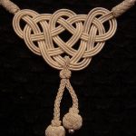 Ornament from a cord for a window curtain