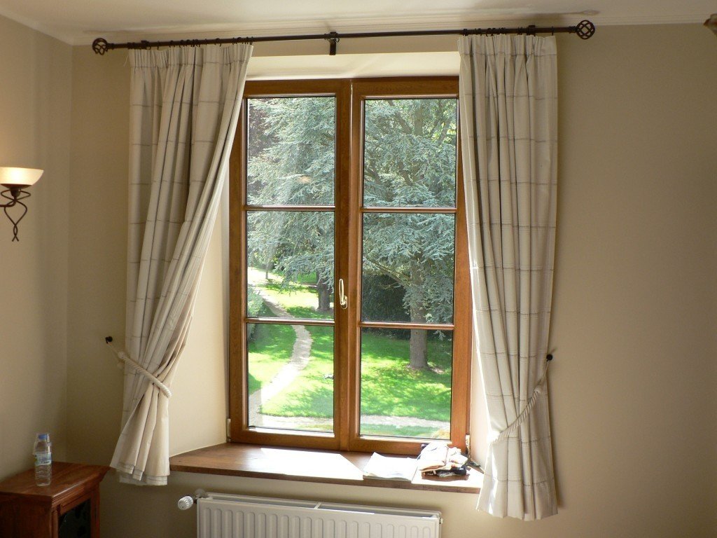 short curtains below the window sill