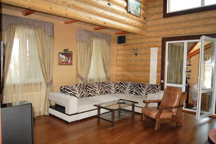 curtains on small windows in a wooden house
