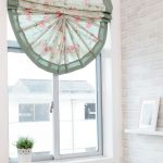 curtains on small windows in a wooden house