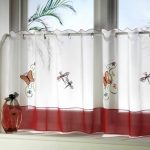 curtains on the small windows of the cafe