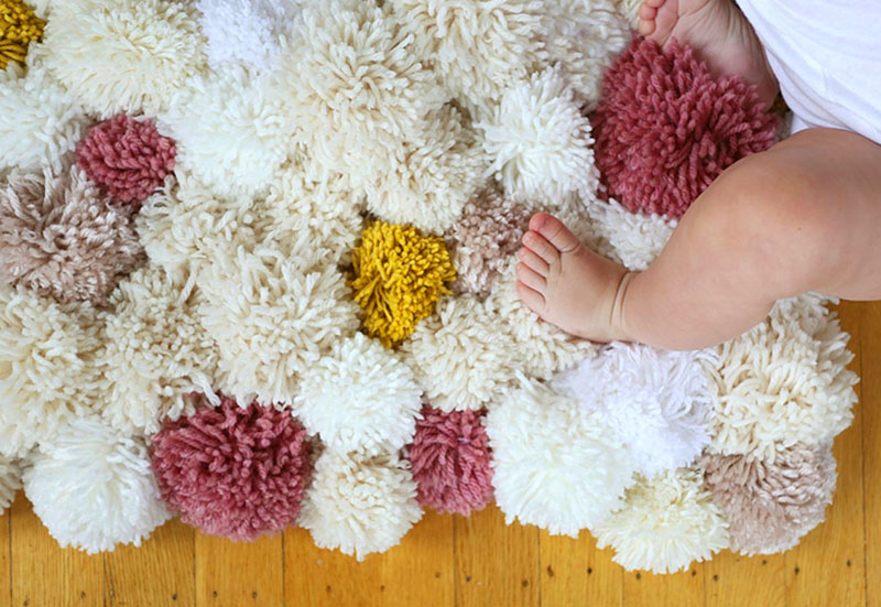 tapis fait de pompons faites le vous même photo