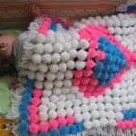 plaid moelleux de pompons