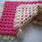 petit plaid de pompons