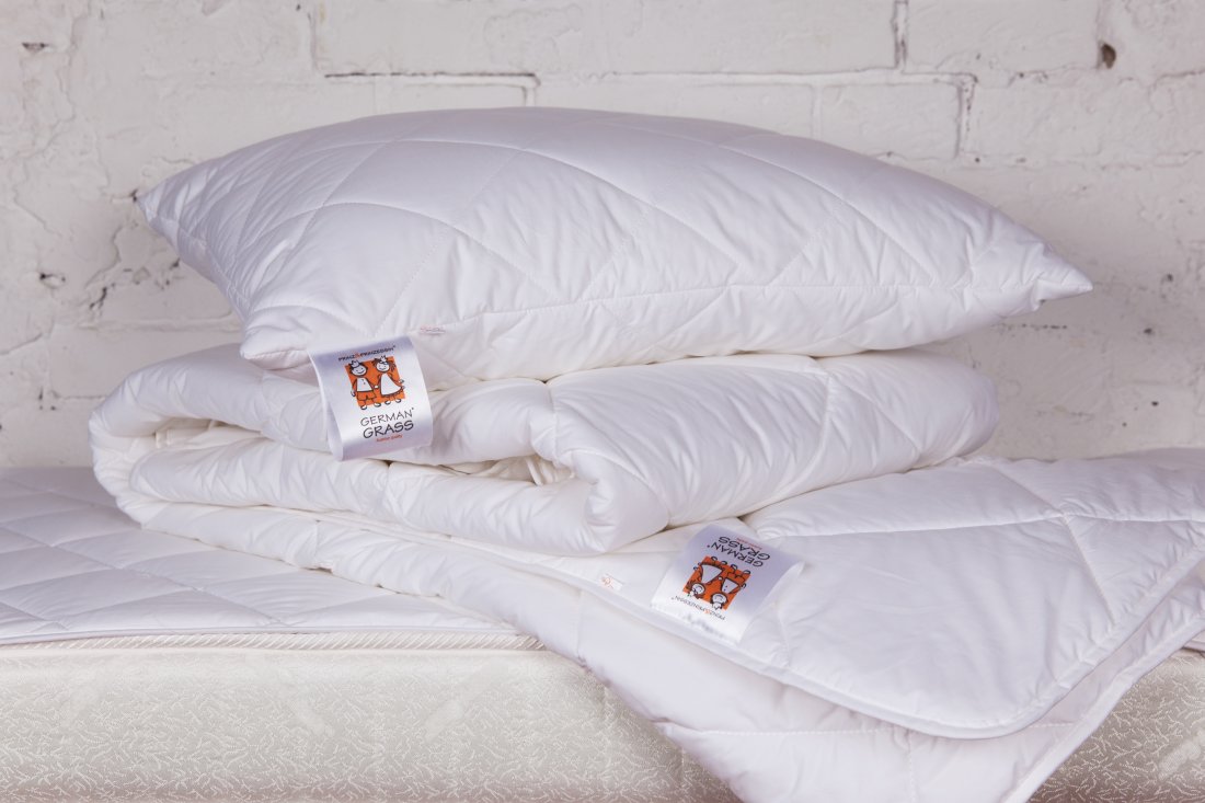 oreillers et couvertures en duvet de cygne